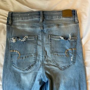 Very high waisted American Eagle ripped blue jeans